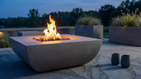 Westport 34 In. X 14 In. Grey round Concrete Propane Pit Table with Electronic Ignition Cover and Lava Rock — Lifestyle
